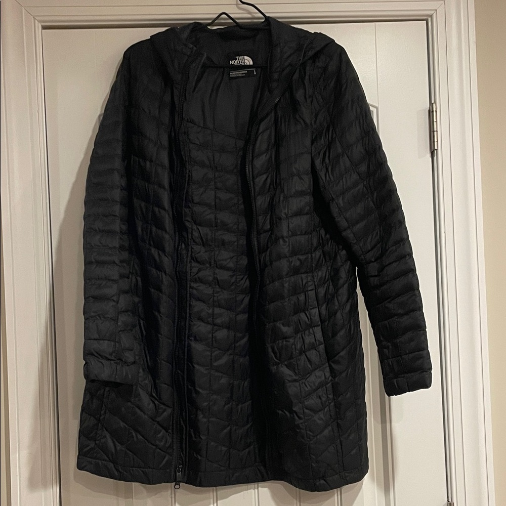 The North Face Women's Black Long Thermoball coat.